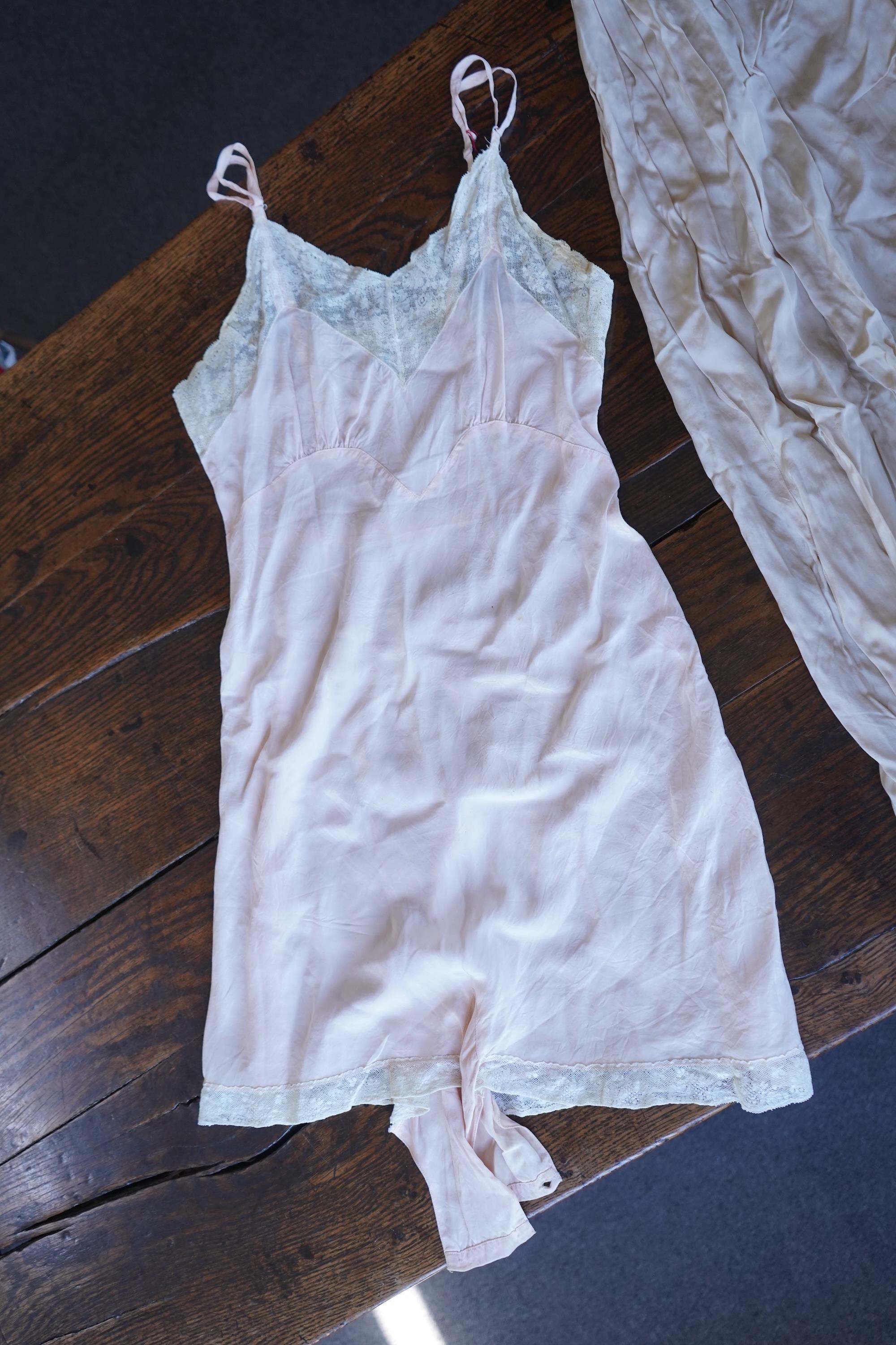 A collection of 1920's-30's silk and satin camisole slips, two cream silk and lace jackets, a lace blouse a silk embroidered blouse, a silk cami, and a collection of silk stockings., Condition- good